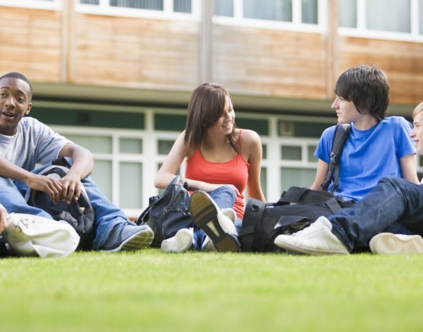 https://www.carolinecavanagh.co.uk/wp-content/uploads/2020/07/college-students-sitting-and-talking-on-campus-lawn-cropped.jpg
